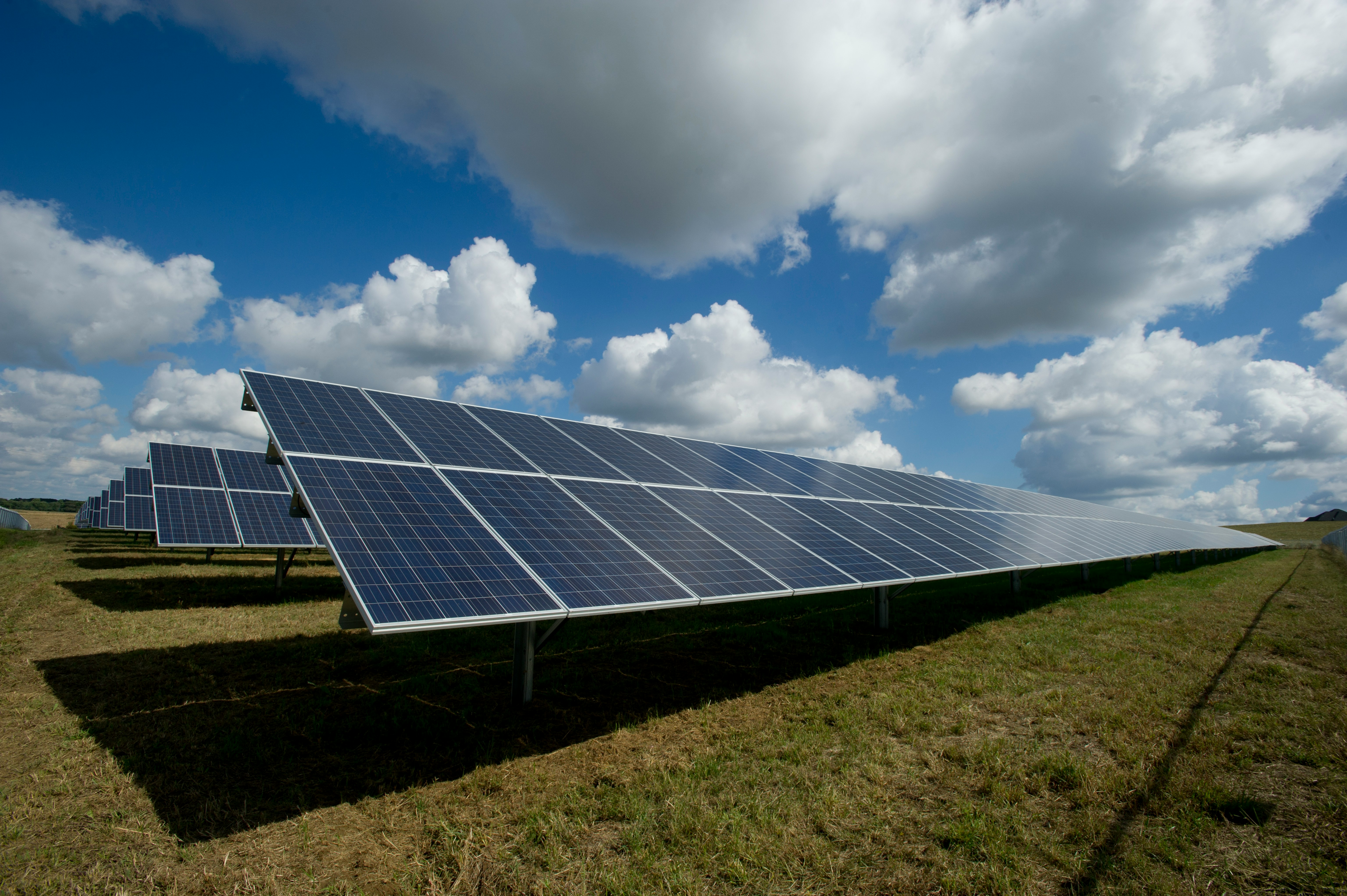 Photo by <a href="https://unsplash.com/@publicpowerorg?utm_source=unsplash&utm_medium=referral&utm_content=creditCopyText">American Public Power Association</a> on <a href="https://unsplash.com/photos/solar-panels-on-green-field-513dBrMJ_5w?utm_source=unsplash&utm_medium=referral&utm_content=creditCopyText">Unsplash</a>